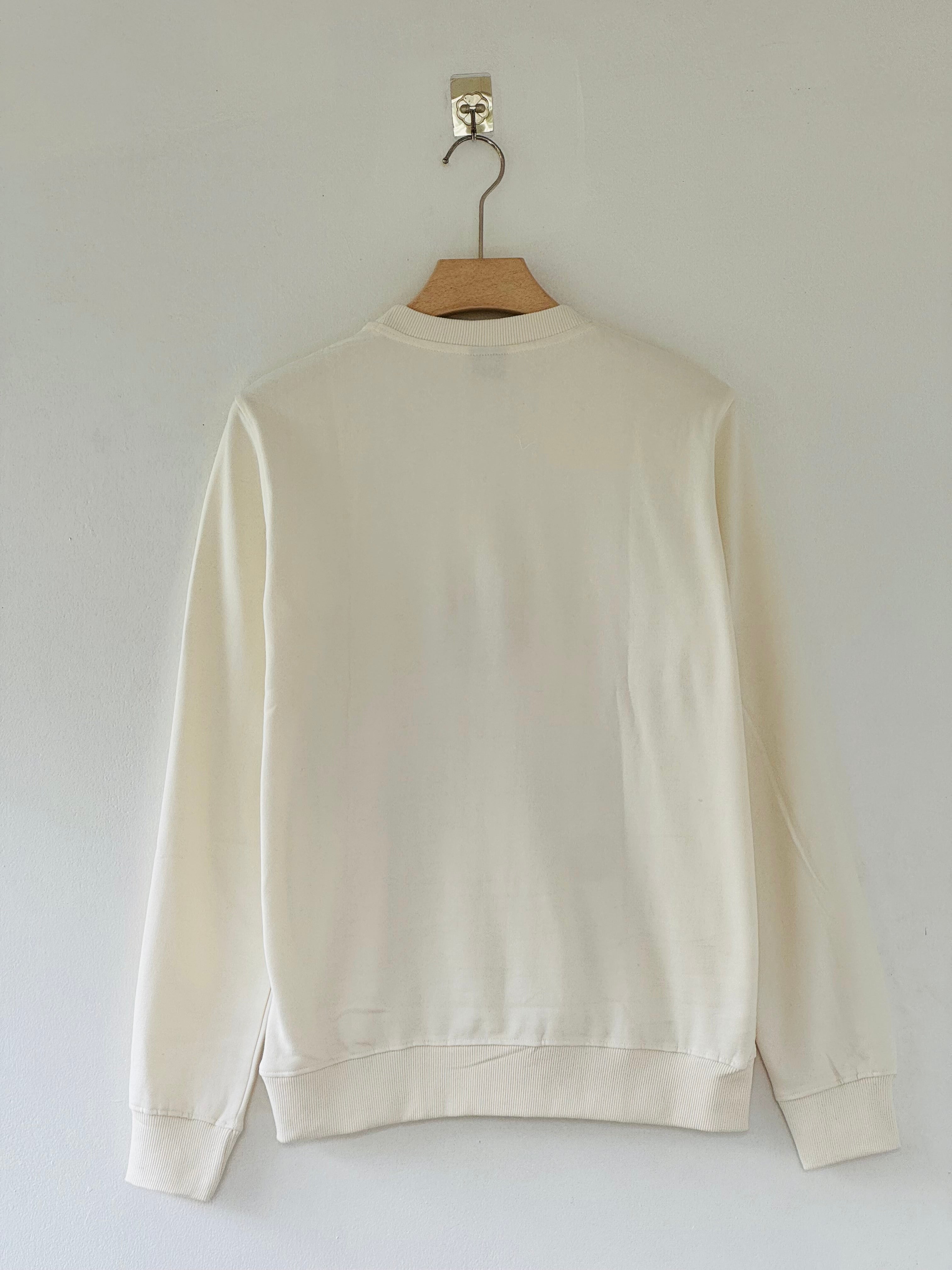cream-colored FC Barcelona x Cactus Jack sweatshirt