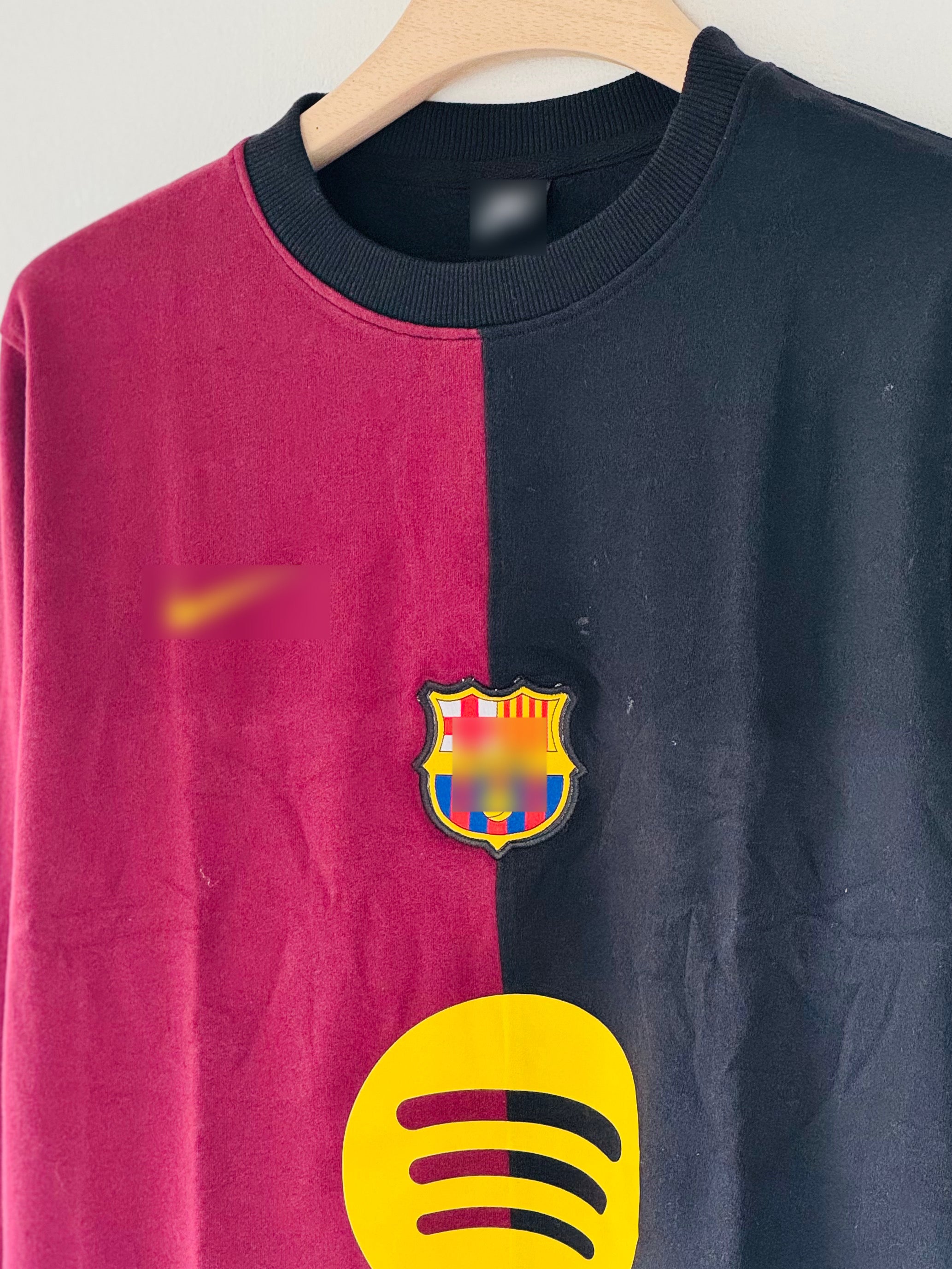 Barcelona FC crew-neck sweatshirt features a distinct split design in maroon and black