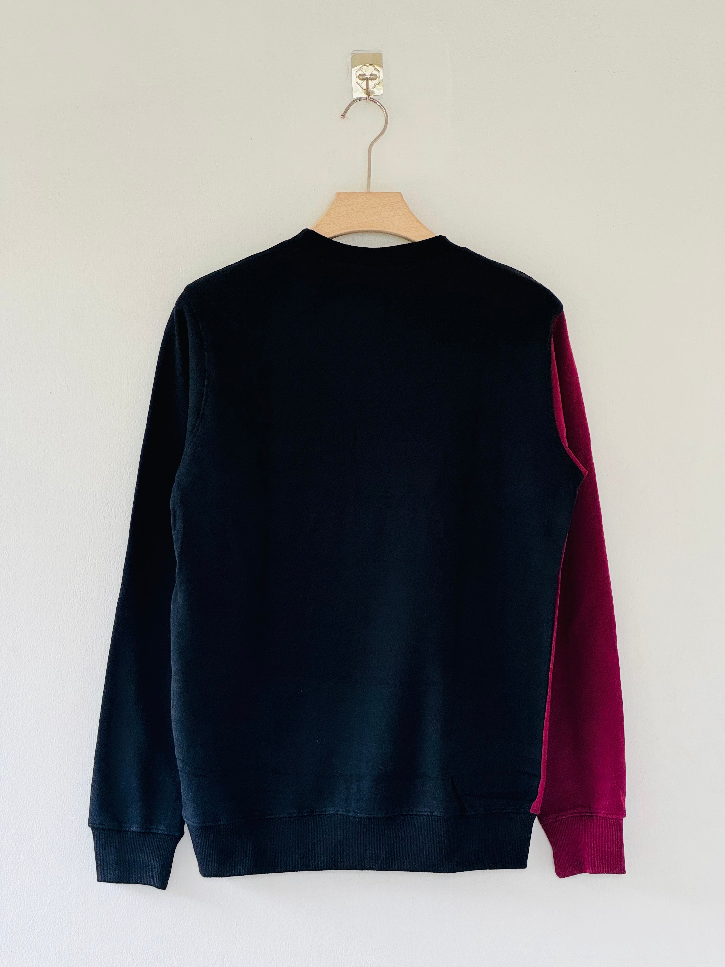 Barcelona FC crew-neck sweatshirt features a distinct split design in maroon and black