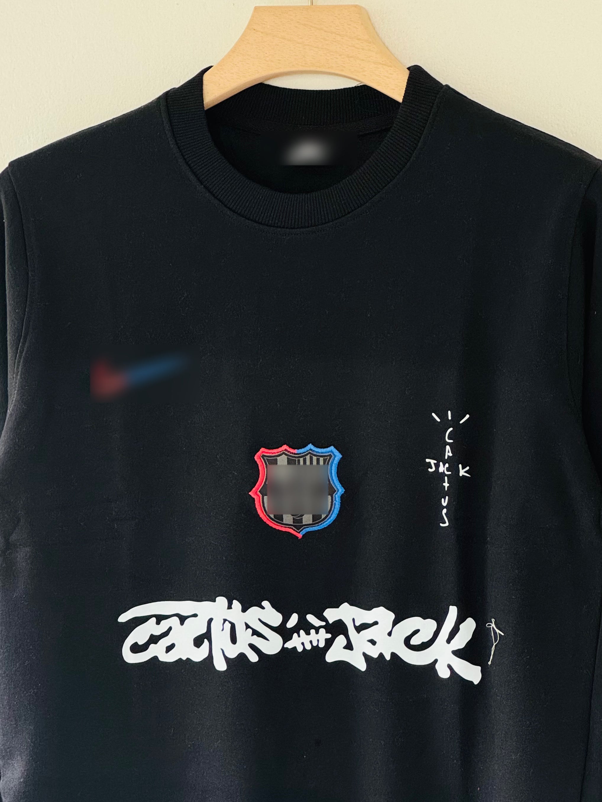 FC Barcelona x Cactus Jack sweatshirt features bold white graffiti-style "Cactus Jack" T-shirt