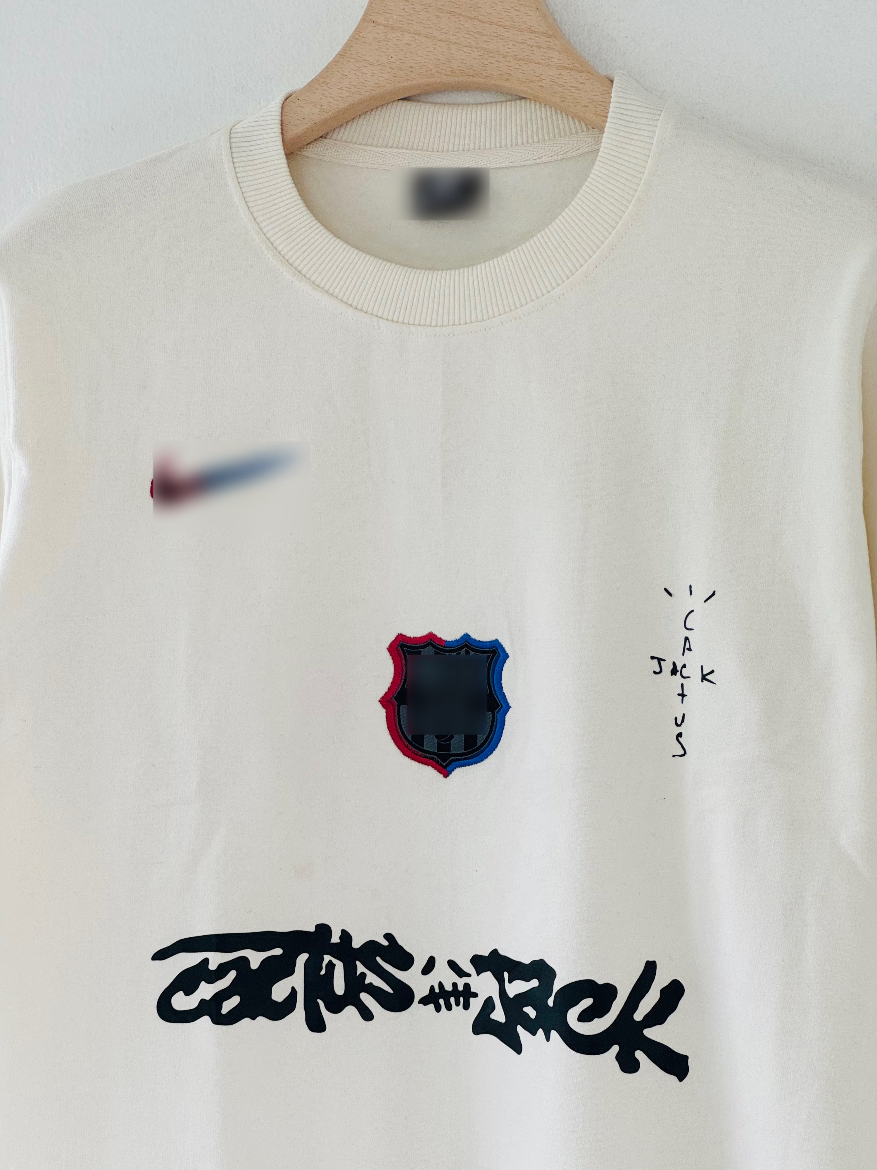 cream-colored FC Barcelona x Cactus Jack sweatshirt