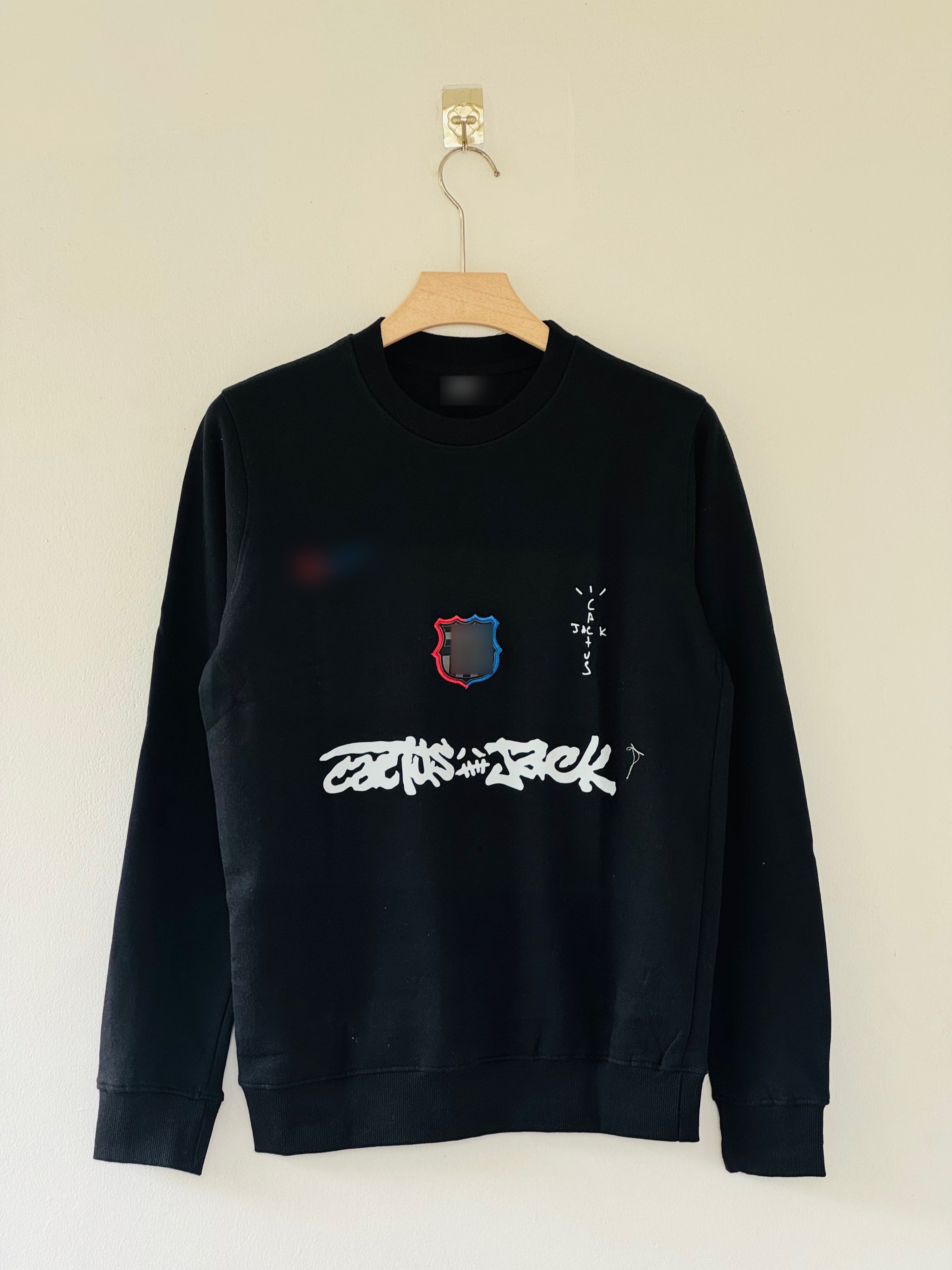 FC Barcelona x Cactus Jack sweatshirt features bold white graffiti-style "Cactus Jack" T-shirt